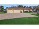Three-car garage with paved driveway at 8323 W Lake Marion Rd, Haines City, FL 33844