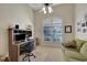 Home office features built-in shelving, a desk, and a comfortable couch at 8323 W Lake Marion Rd, Haines City, FL 33844