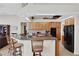 Kitchen features granite countertops, wood cabinets and a breakfast bar at 8323 W Lake Marion Rd, Haines City, FL 33844