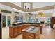 Spacious kitchen boasts a large island, granite countertops, and a breakfast bar at 8323 W Lake Marion Rd, Haines City, FL 33844