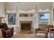 Living room with fireplace and lake view at 8323 W Lake Marion Rd, Haines City, FL 33844