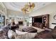 Spacious living room with leather furniture and a large TV at 8323 W Lake Marion Rd, Haines City, FL 33844