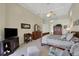 Main bedroom with a king-size bed, dark wood furniture and a large TV at 8323 W Lake Marion Rd, Haines City, FL 33844