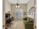 Home office features built-in shelving and a comfortable sofa at 8323 W Lake Marion Rd, Haines City, FL 33844