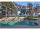 Relaxing screened-in pool area with lake view at 8323 W Lake Marion Rd, Haines City, FL 33844