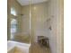 Walk-in shower with glass enclosure and tiled walls at 8323 W Lake Marion Rd, Haines City, FL 33844