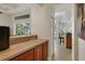 Wet bar with tile countertops and wood cabinetry at 8323 W Lake Marion Rd, Haines City, FL 33844