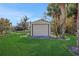 Large yard with storage shed and palm trees at 8323 W Lake Marion Rd, Haines City, FL 33844