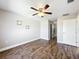 Spacious bedroom with wood-look floors and ceiling fan at 834 Avenue I Ne, Winter Haven, FL 33881