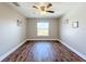 Spacious bedroom with wood-look floors and a window at 834 Avenue I Ne, Winter Haven, FL 33881