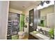 Modern bathroom with granite countertop and large mirror at 918 Revere Ave, Haines City, FL 33844