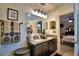 Double vanity bathroom with granite countertop and modern lighting at 918 Revere Ave, Haines City, FL 33844