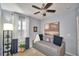 Cozy bedroom with daybed and window with plantation shutters at 918 Revere Ave, Haines City, FL 33844