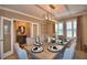 Bright dining room with large table and access to foyer at 918 Revere Ave, Haines City, FL 33844
