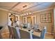 Bright dining room with large table, art, and clock at 918 Revere Ave, Haines City, FL 33844