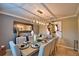 Elegant dining room features a large table and modern chandelier at 918 Revere Ave, Haines City, FL 33844