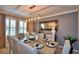 Elegant dining room features a large table, chandelier, and stylish decor at 918 Revere Ave, Haines City, FL 33844