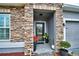 Inviting entryway with a stone facade and a glass front door at 918 Revere Ave, Haines City, FL 33844