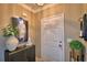 Light and airy entryway with a large door and decorative accents at 918 Revere Ave, Haines City, FL 33844