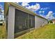 House exterior showcasing screened porch and backyard at 918 Revere Ave, Haines City, FL 33844
