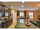 Island kitchen with granite countertops and dark wood cabinets at 918 Revere Ave, Haines City, FL 33844