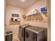 Laundry room with washer, dryer, and shelving at 918 Revere Ave, Haines City, FL 33844