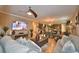 Living room with fireplace and large TV, open to kitchen at 918 Revere Ave, Haines City, FL 33844