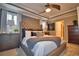 Spacious main bedroom with tufted headboard and ensuite access at 918 Revere Ave, Haines City, FL 33844