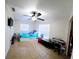 Bright bedroom with tile flooring, a double bed, and window coverings at 930 Thompson Ave, Frostproof, FL 33843