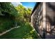 Lush backyard with a screened-in porch and well-maintained garden creates a private and relaxing outdoor oasis at 1 Casarena Ct, Winter Haven, FL 33881