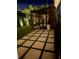 Beautiful backyard featuring modern pavers, a lush lawn, and a screened-in lanai for relaxed outdoor living at 1 Casarena Ct, Winter Haven, FL 33881