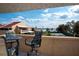 Balcony view overlooking waterfront and tennis courts in resort-style living at 1 Casarena Ct, Winter Haven, FL 33881