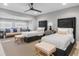 Spacious bedroom with two beds, seating area, and neutral decor at 1 Casarena Ct, Winter Haven, FL 33881