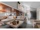 Open-concept living room with stairs and direct views into the kitchen and dining area at 1 Casarena Ct, Winter Haven, FL 33881