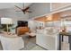 Bright living room with modern furnishings, stylish decor, and wood-paneled ceiling at 1 Casarena Ct, Winter Haven, FL 33881