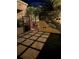 Well designed patio with stone pavers and tropical landscaping around the gated entrance at 1 Casarena Ct, Winter Haven, FL 33881