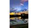 Stunning lake view reflecting the sky's vibrant sunset with a fountain as a focal point at 10202 Village Dr # 22, Lake Wales, FL 33898