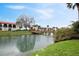 Community pond view featuring charming wooden bridges connecting the property's buildings at 10202 Village Dr # 22, Lake Wales, FL 33898