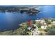 Lakefront homes with mature trees and lake access at 1048 Sunset Trail, Babson Park, FL 33827