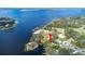Lakefront property with private boat access and lush, mature trees at 1048 Sunset Trail, Babson Park, FL 33827