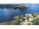 Expansive aerial view of waterfront properties along a beautiful, deep blue lake at 1048 Sunset Trail, Babson Park, FL 33827