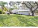 Desirable waterfront home with a spacious backyard, shed, and lush landscaping offers tranquility at 1048 Sunset Trail, Babson Park, FL 33827
