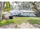 Well-maintained backyard with lush green grass and a storage shed for all your outdoor needs at 1048 Sunset Trail, Babson Park, FL 33827