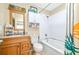 Bathroom featuring a vanity, toilet, and bath tub with white tile surround at 1048 Sunset Trail, Babson Park, FL 33827