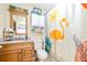 Bathroom featuring a vanity, flamingo shower curtain, toilet, and decorations at 1048 Sunset Trail, Babson Park, FL 33827