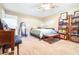 Bedroom featuring a bed, a shelving unit of games, and light carpet at 1048 Sunset Trail, Babson Park, FL 33827