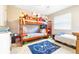 Bedroom with bunk beds, a bed and some carpet at 1048 Sunset Trail, Babson Park, FL 33827
