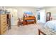 Bedroom featuring a piano, a bed and a mirror at 1048 Sunset Trail, Babson Park, FL 33827
