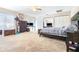 Large bedroom with a ceiling fan, mirrored closet doors, and comfortable furnishings at 1048 Sunset Trail, Babson Park, FL 33827