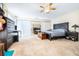 Spacious bedroom with a ceiling fan, mirrored closet doors, and ample natural light at 1048 Sunset Trail, Babson Park, FL 33827